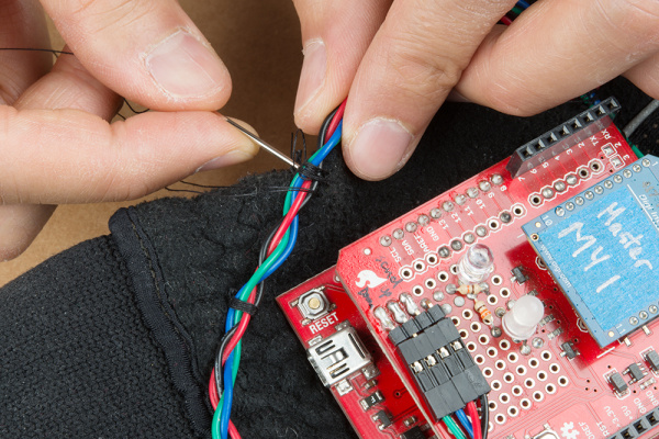 Sew RedBoard and Wires to the Glove Using Non-Conductive Thread