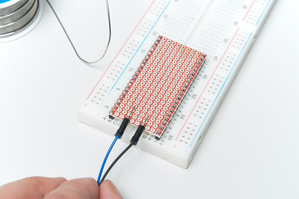 Jumper wires soldered to base plate for trigger signal