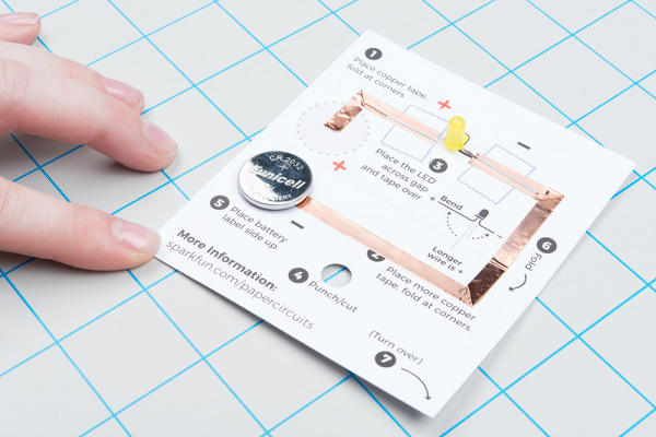 Placing battery with labeled side up on the template