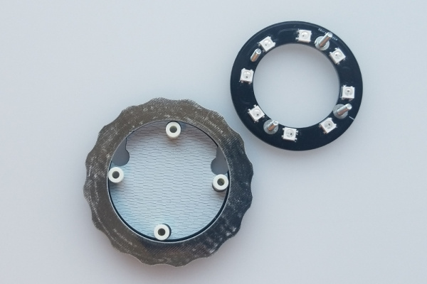 The larger ring shaped board is now sitting on top of the round board with four nylon standoffs sitting along its inside circumference. The LED ring still sits to the side.