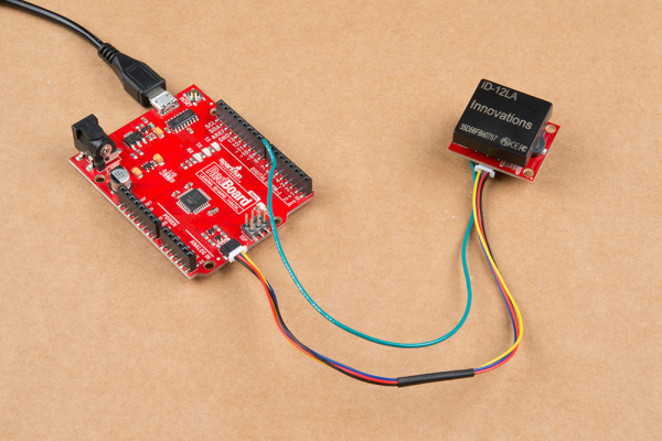 Here is an image of the Qwiic RFID module connected to the Redboard Edge via a Qwiic cable with an additional wire connecting the product's interrupt with pin 8 on the Redboard.