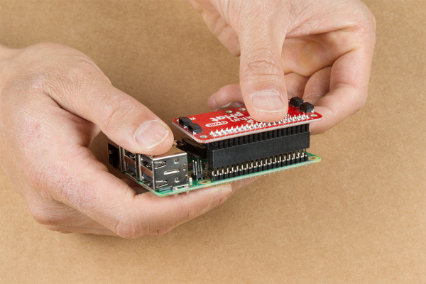 Qwiic pHat Being Inserted into Raspberry Pi