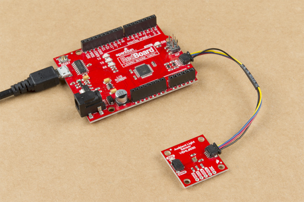 This image shows a picture of the SparkFun Ambient Light Sensor connected to a Redboard Qwiic by a Qwiic cable.