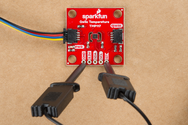 IC Hooks connected to the TMP117's interrupt and ground pins