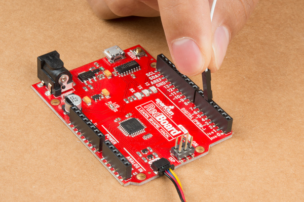 Qwiic Connector Attached to RedBoard Qwiic and an IC Hook on an Edge Connector