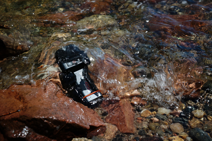 The SparkPNT TX2 submerged in a stream.